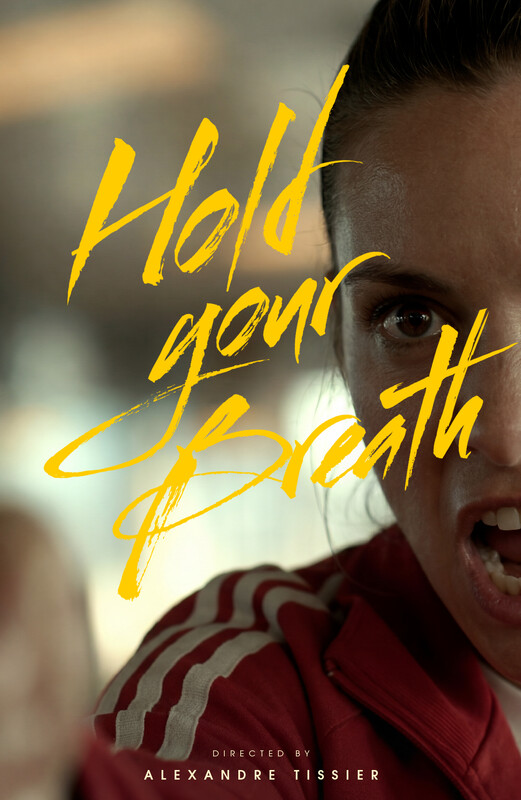 Poster for Hold Your Breath: a young athlete in a red track jacket shouting in close-up, the title hand-brushed in yellow across her face